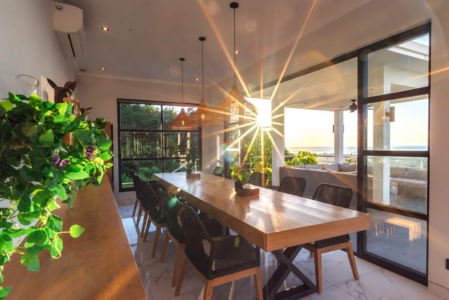 Dining room filled with sunset light beside the terrace.